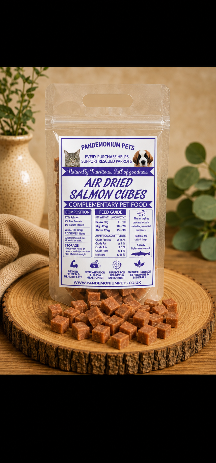 Air dried salmon cubes in a resealable Pandemonium Pets pouch with salmon cubes on a wooden board