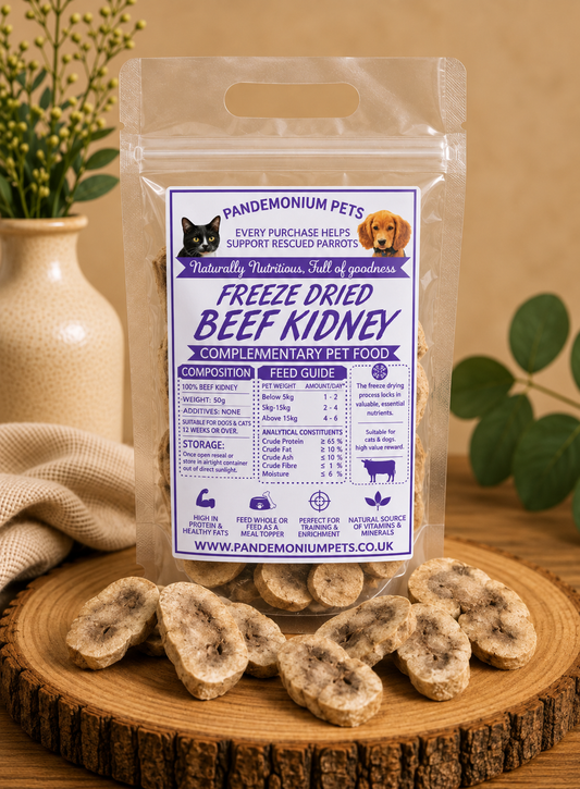Freeze dried beef kidney in a resealable Pandemonium Pets pouch with beef kidney pieces on a wooden board