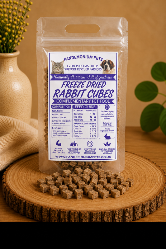 Freeze dried rabbit cubes in a resealable Pandemonium Pets pouch with rabbit cubes on a wooden board