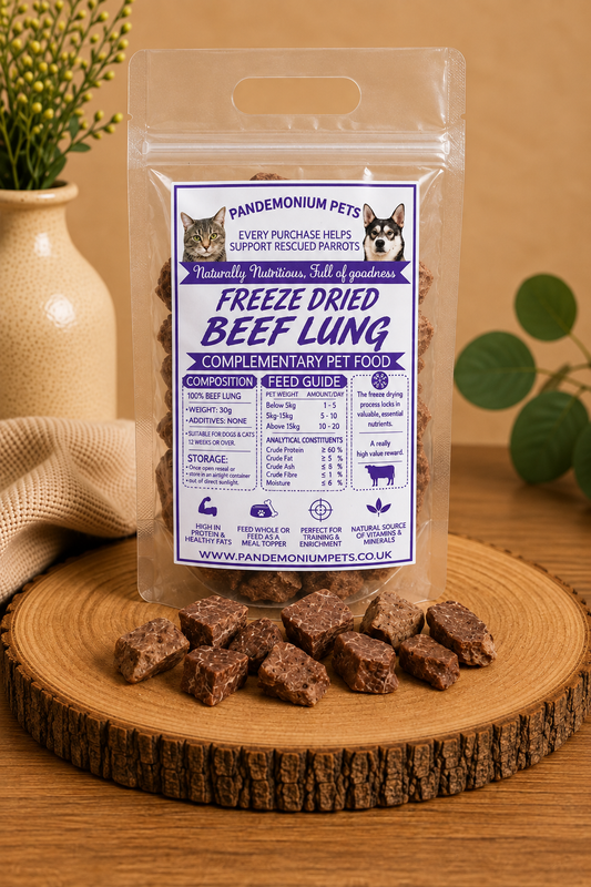 Freeze dried beef lung in a resealable Pandemonium Pets pouch with beef lung pieces on a wooden board