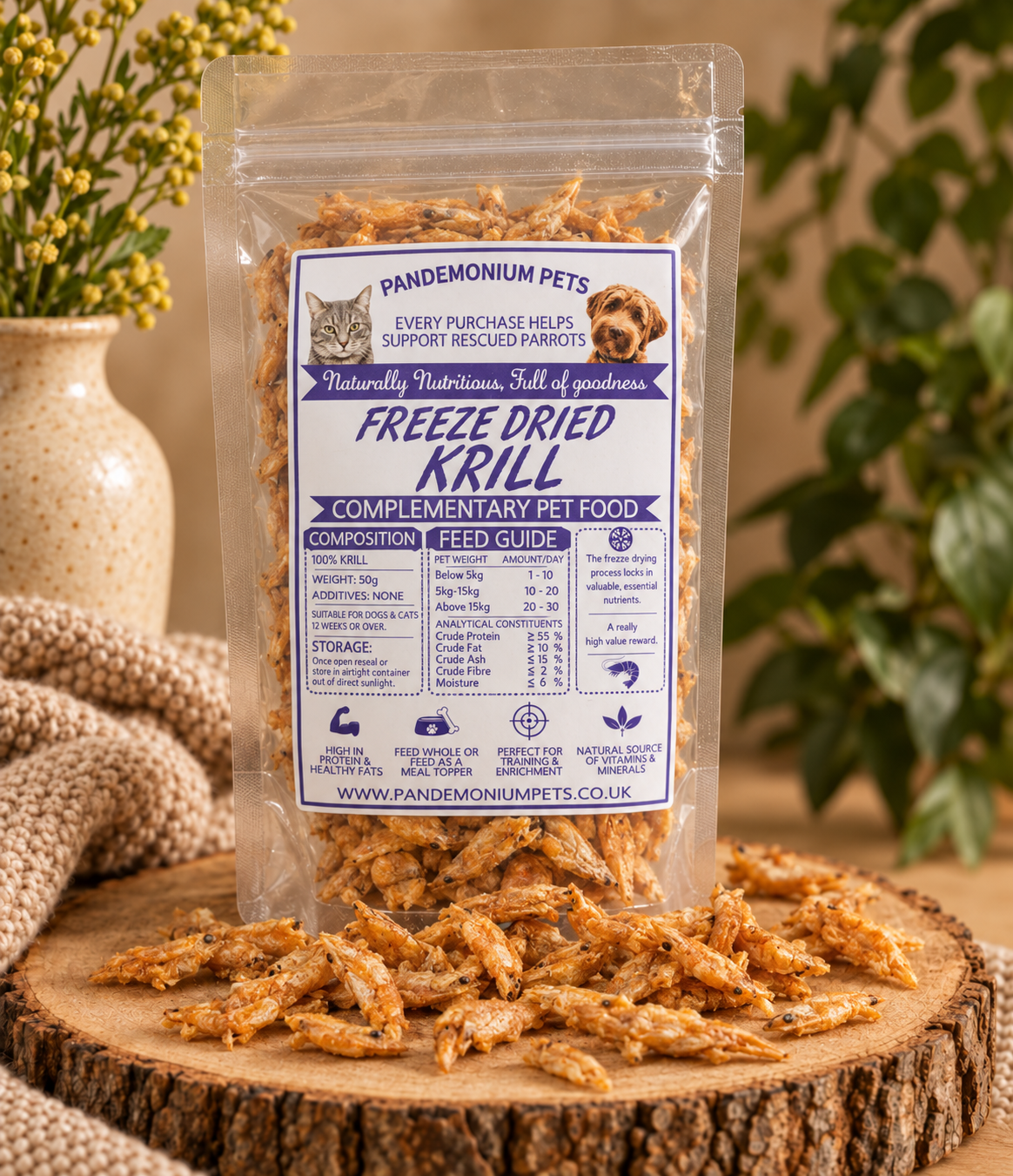 Pandemonium Pets freeze dried krill pet treats in a clear 50g bag with krill pieces displayed on a wooden stand