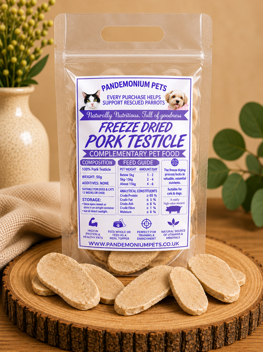 Freeze dried pork testicle in a resealable Pandemonium Pets pouch with pork testicle pieces on a wooden board