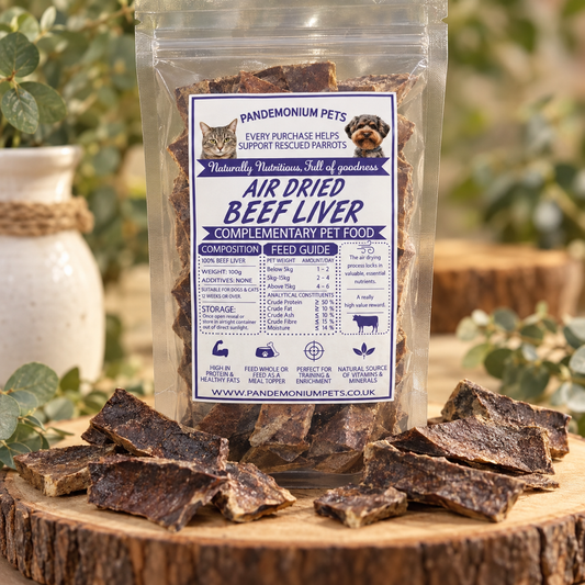 Pandemonium Pets air dried beef liver pet treats in a clear 100g bag with pieces displayed on a wooden stand
